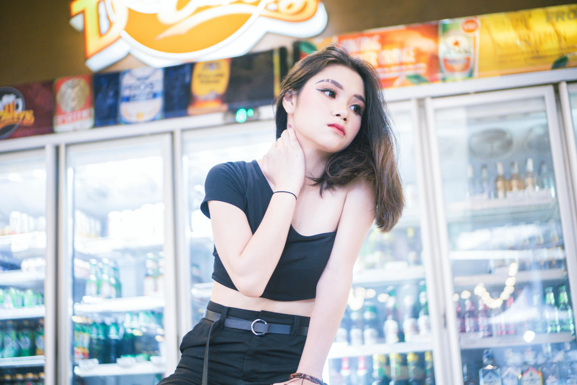 an image of a woman posing in front of a store