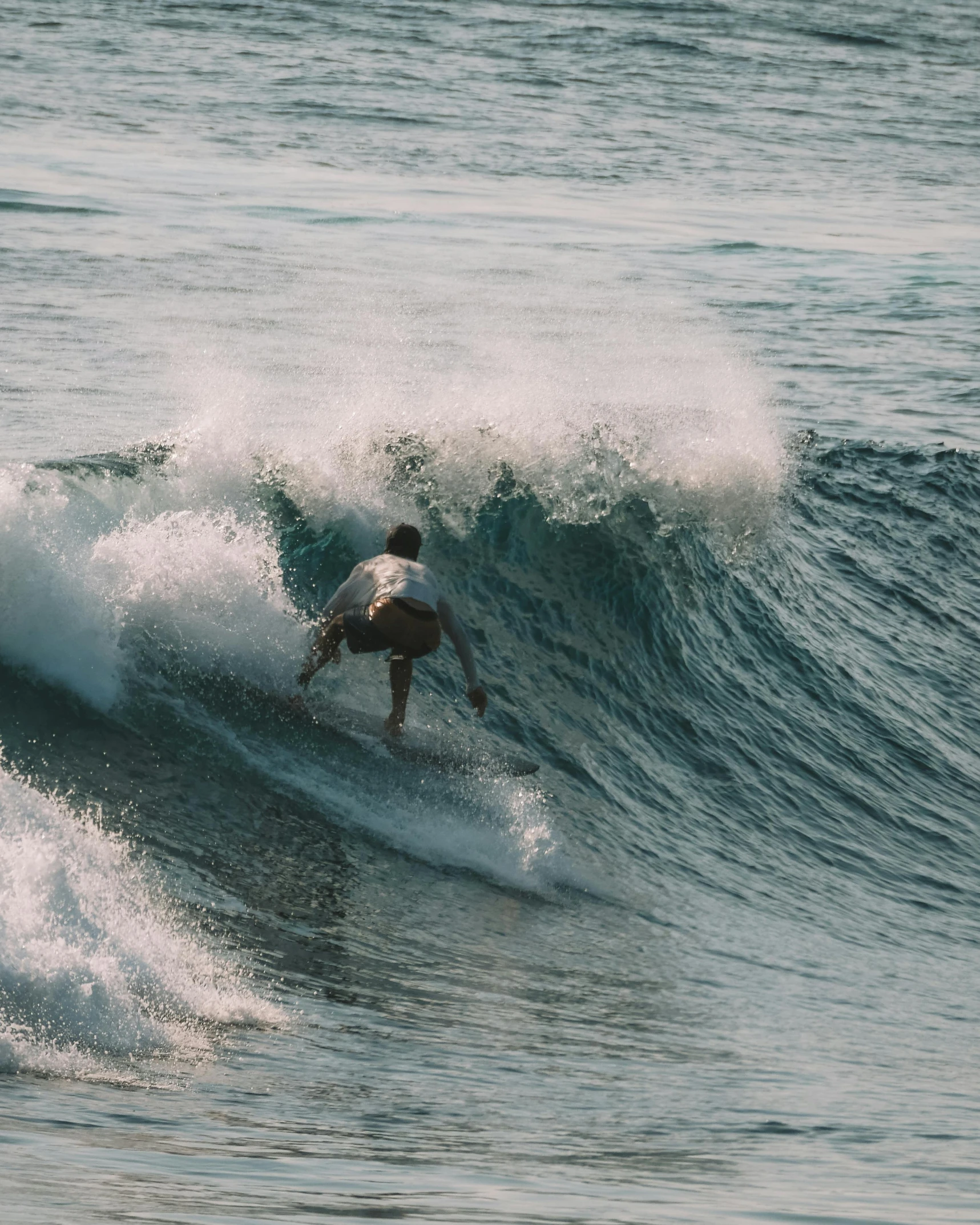 a person riding a surf board on a wave