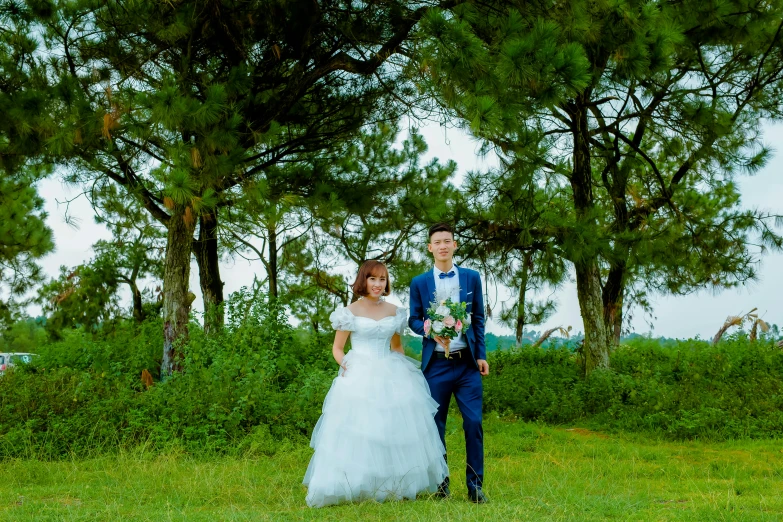 a beautiful woman in a wedding dress standing next to a man