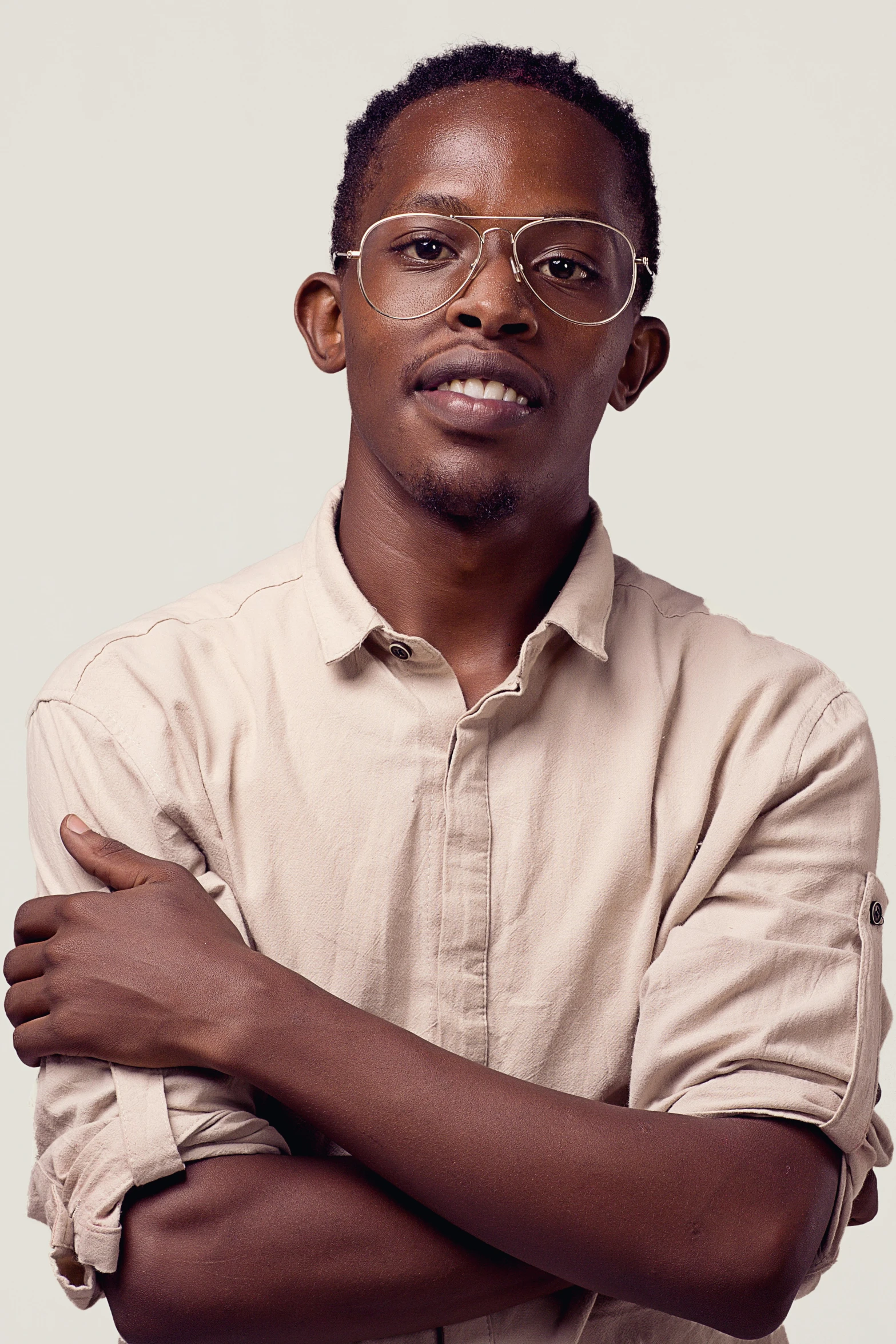 a man posing for the camera wearing glasses
