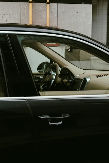the interior of a car parked in front of a building