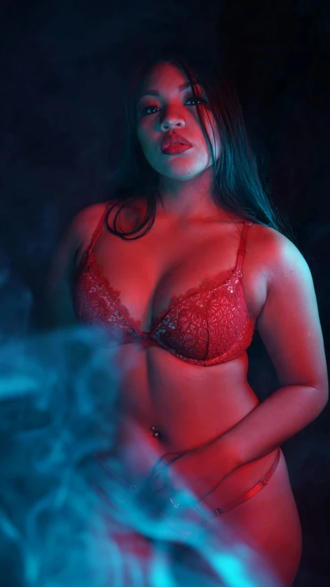 a  black woman in red lingerie posing for the camera