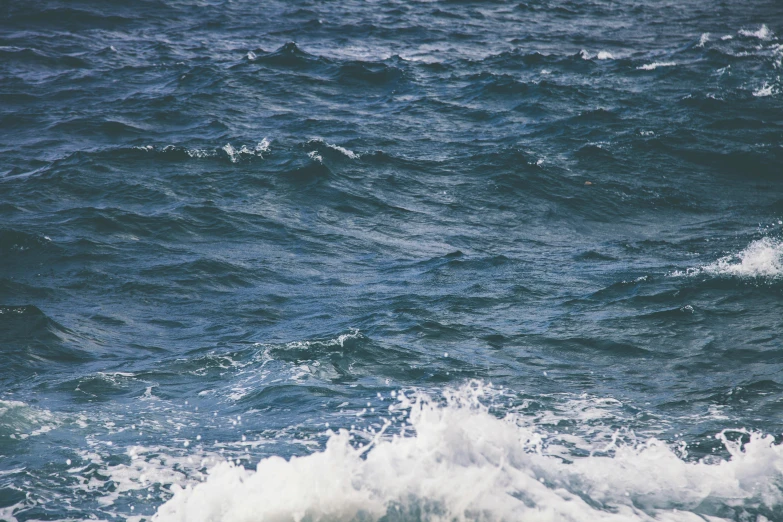 a view from above of the ocean water looking like it was blown in