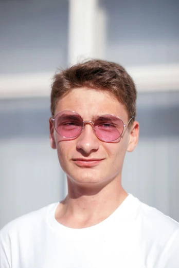 a person wearing sun glasses standing outside