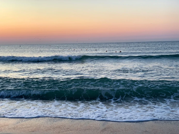 waves coming in at sunset on the beach