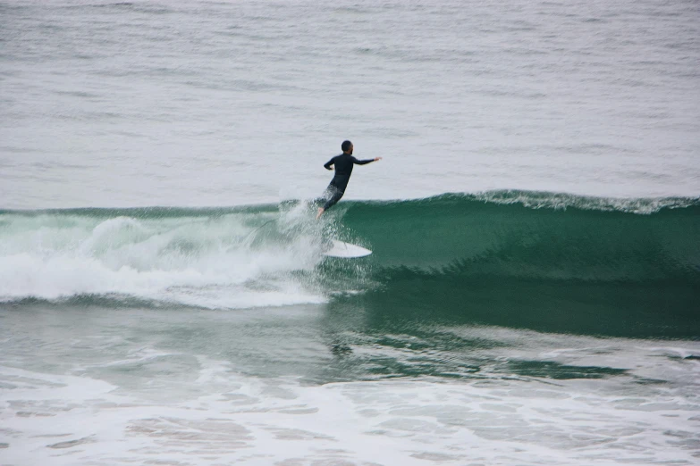 a person surfing on a wave in the ocean