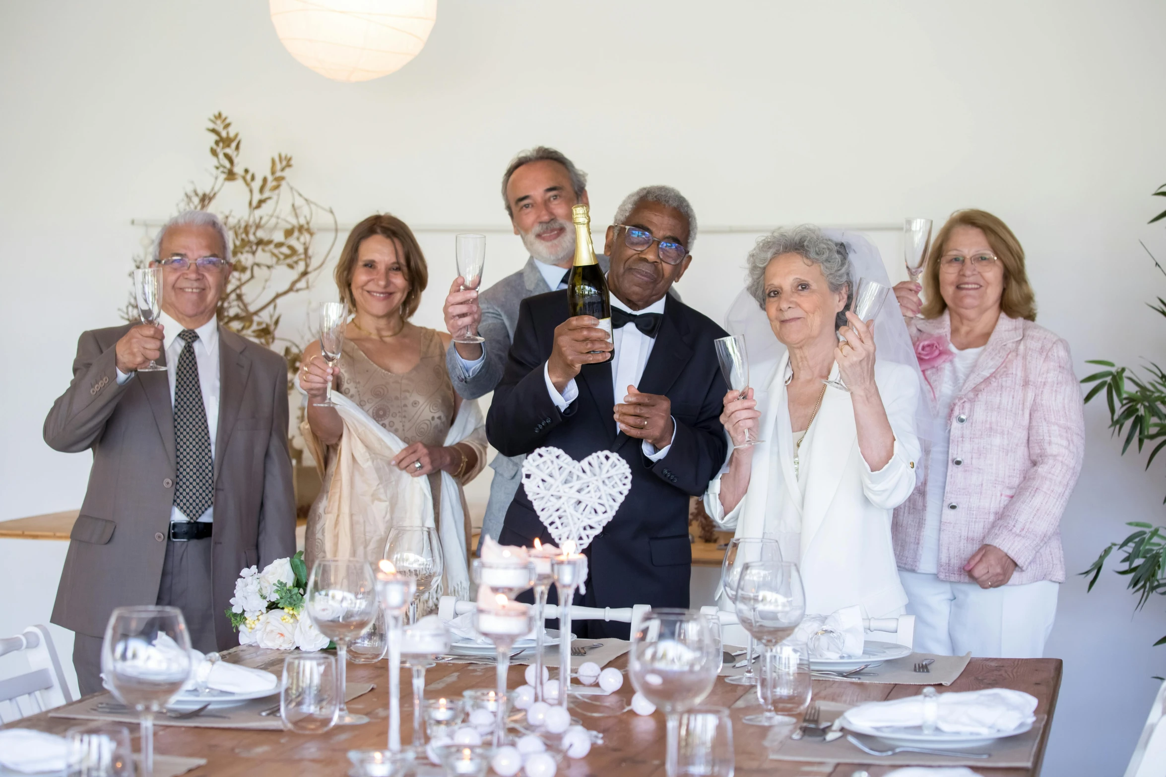 a group of people taking a picture at a table