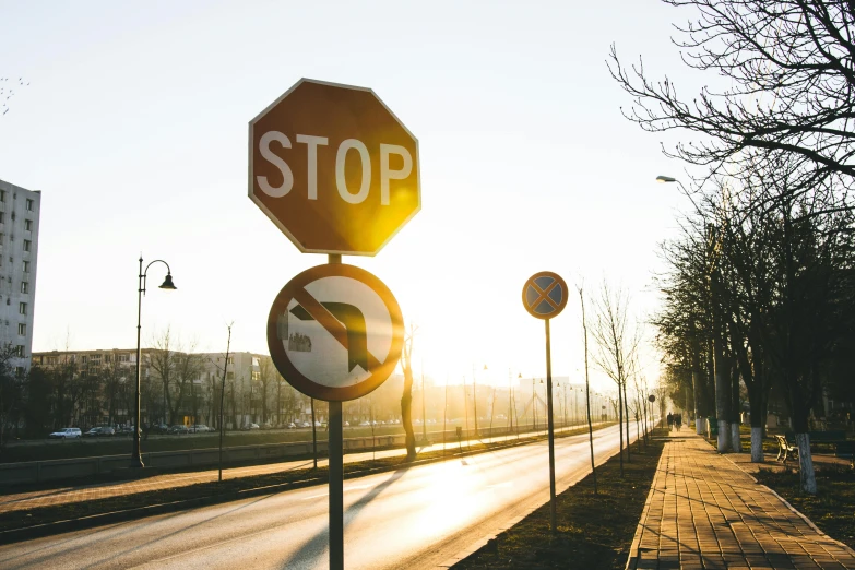 a street sign next to some other road signs