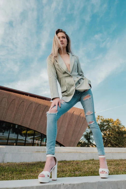 a woman posing on the cement steps outside