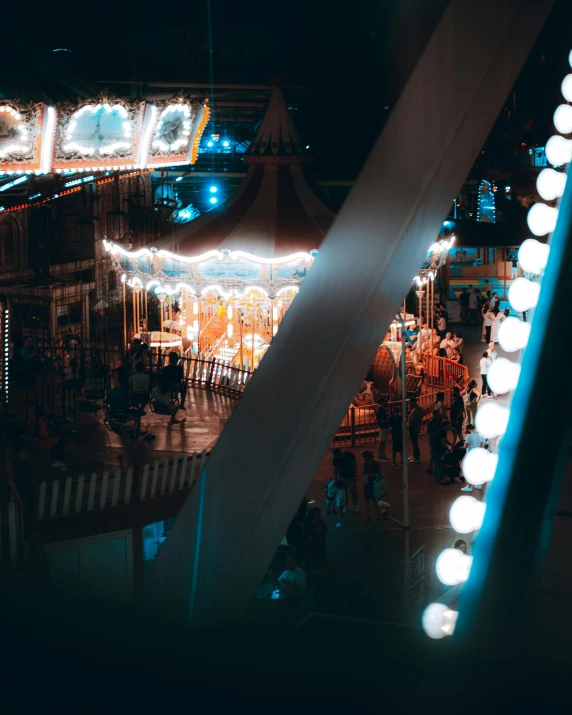a carnival with many lights and a carnival ride