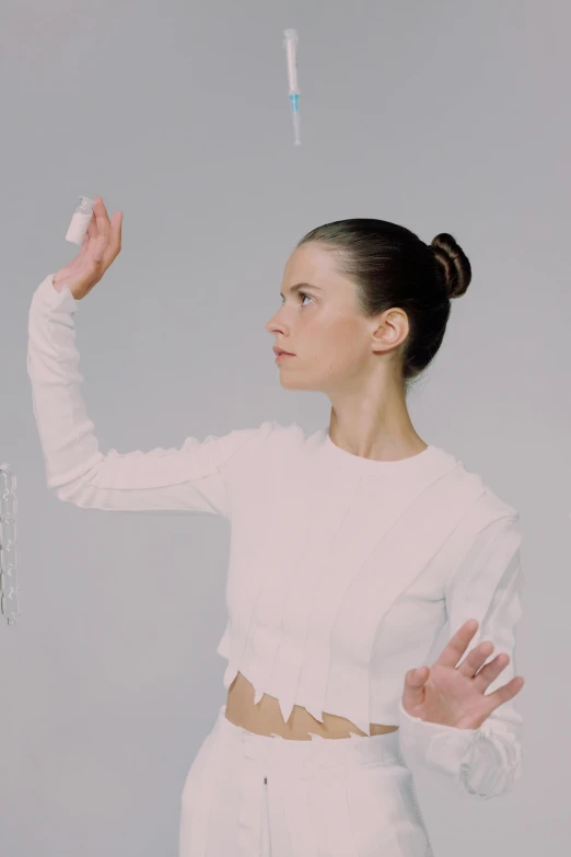 a woman wearing white in a picture with a white top