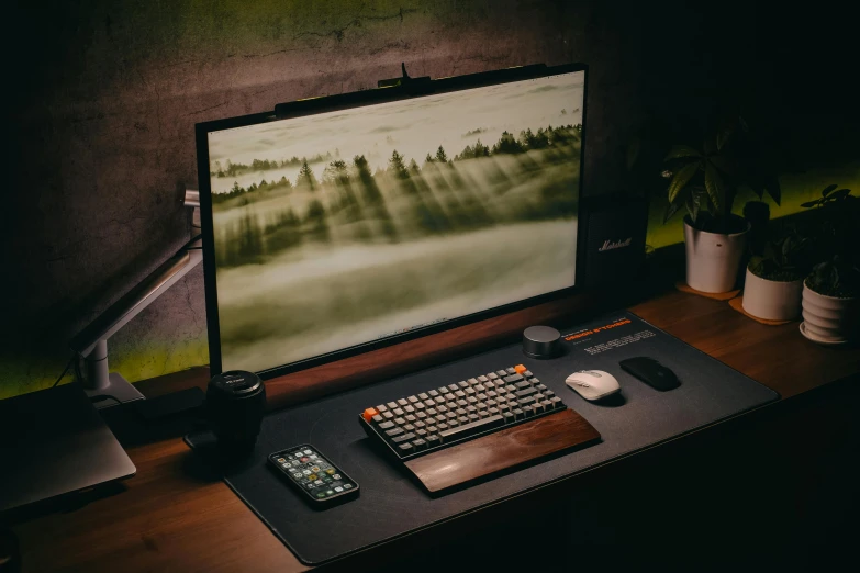 a desktop computer sitting on top of a wooden table