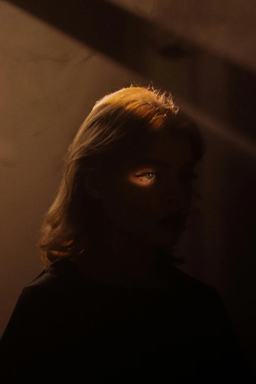 the light is shining on the woman's face