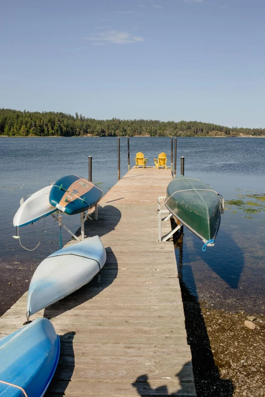 a pier has two boats tied up to the docks