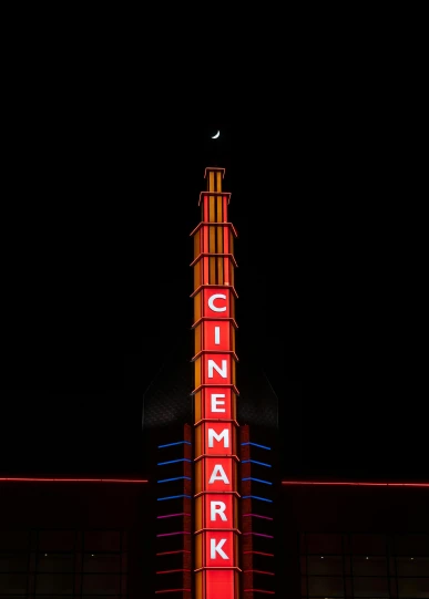 a large neon sign that says cinema ark