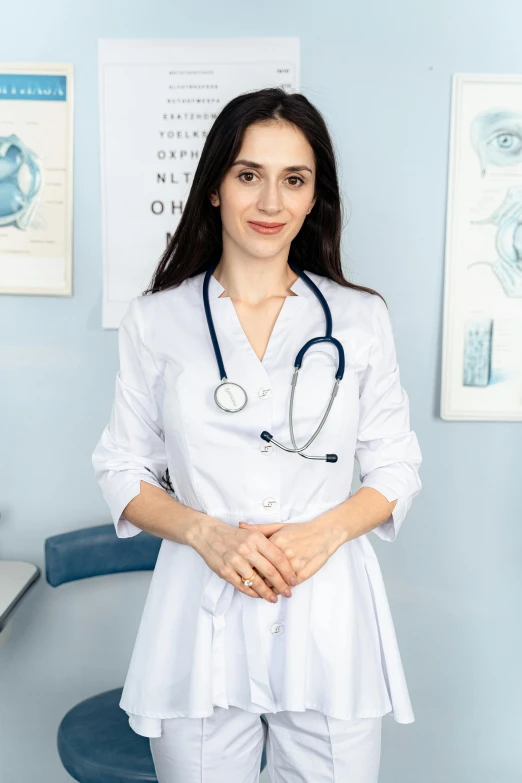 woman doctor in white outfit holding her hand around her waist