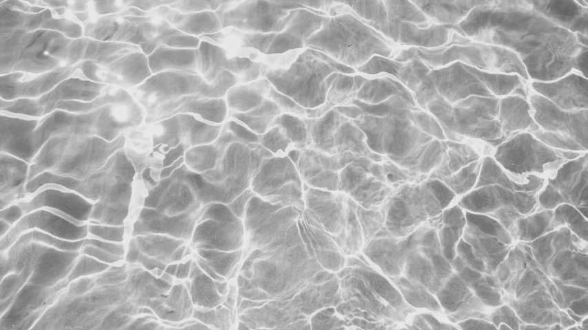 water ripples over a sandy beach area