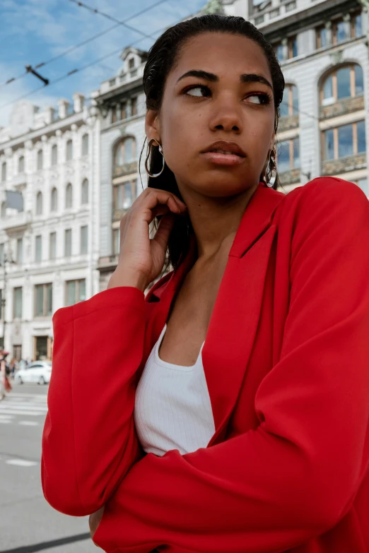 the woman is standing on the street posing