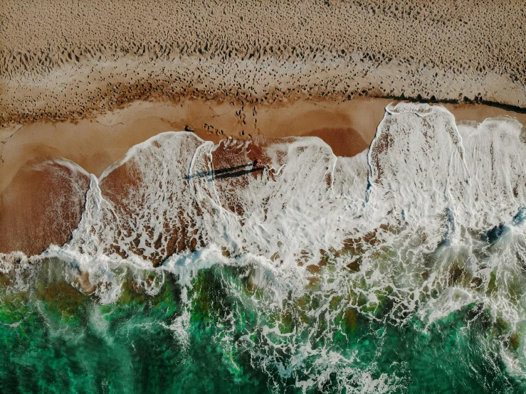 the view from above, of a beach and water