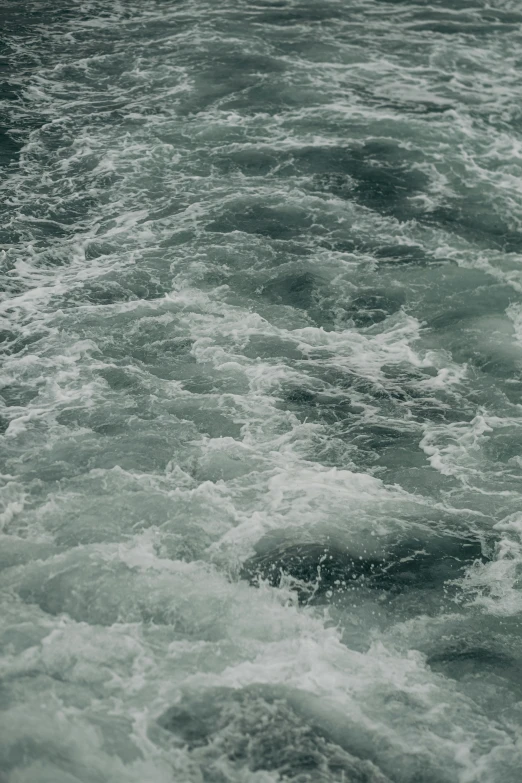 view of large waves from the bottom of a boat