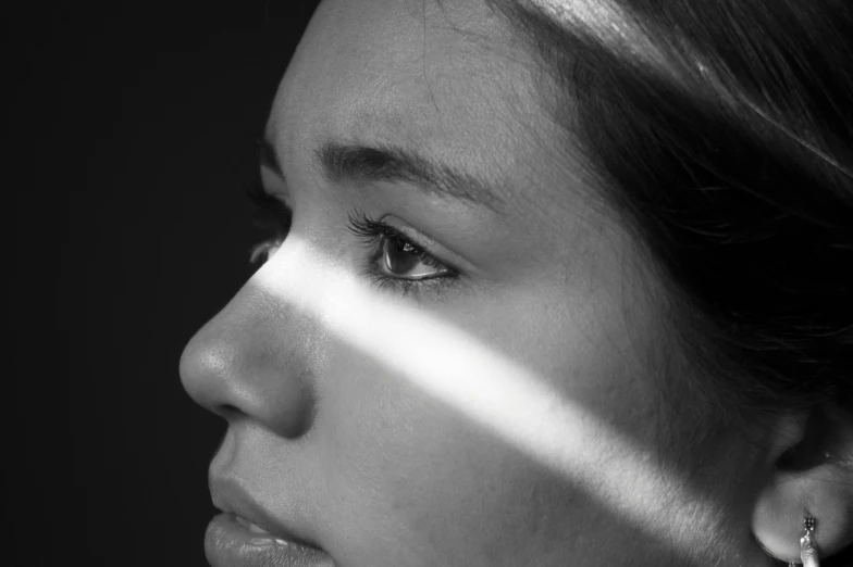 black and white pograph of a woman with her eyes closed