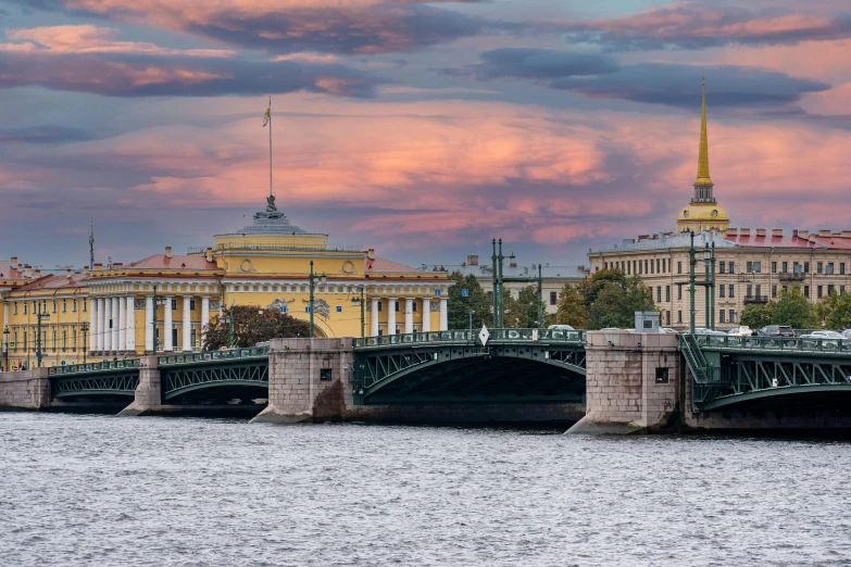 a bridge that is over the water and near buildings