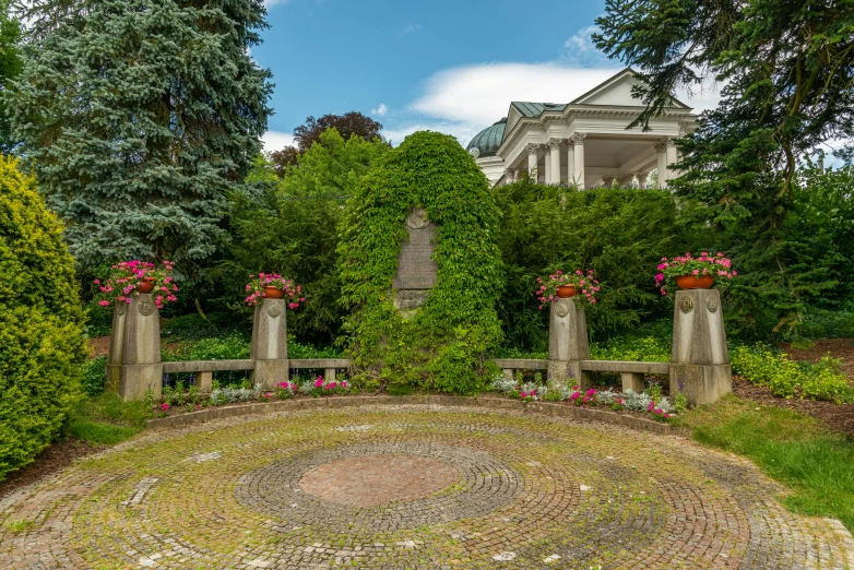 a garden sits in front of a large house