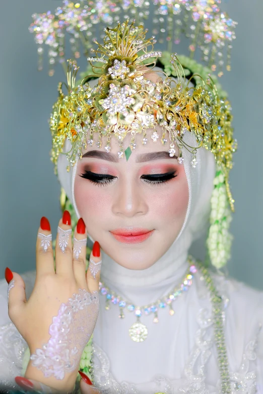 a woman with white makeup and a headdress