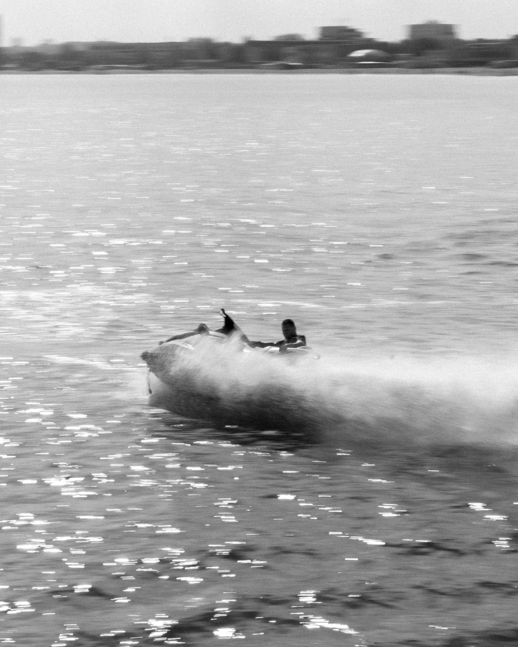 a person is riding the water on his boat