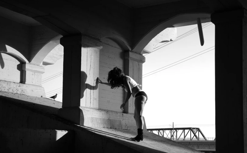 a girl with a skateboard on the stairs