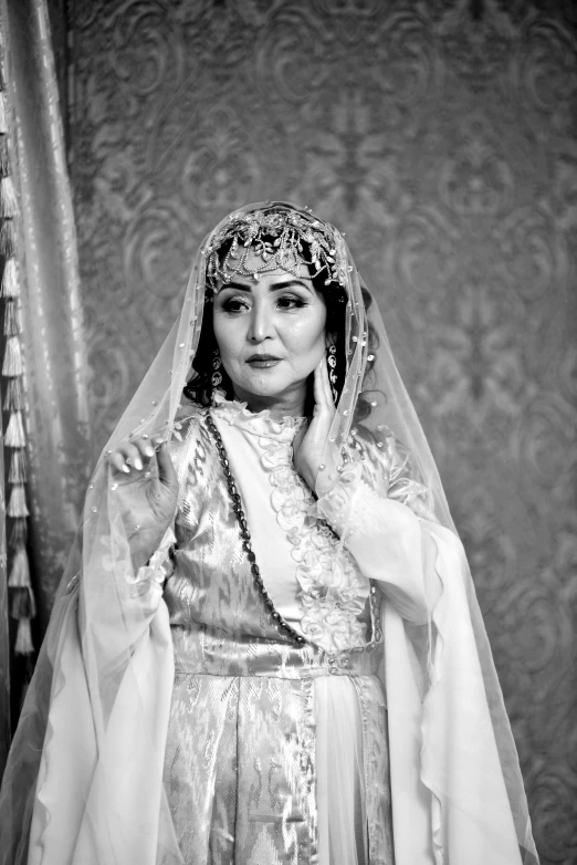 woman in a bridal gown posing for a po