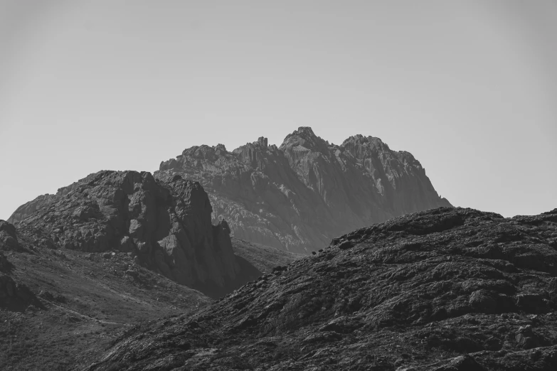 a mountain in black and white with no sky