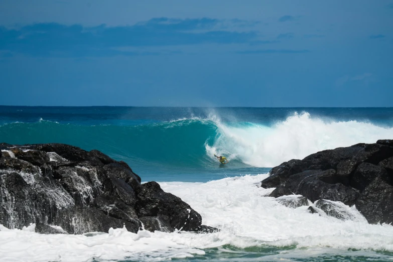 a surfer rides the waves on a nice day