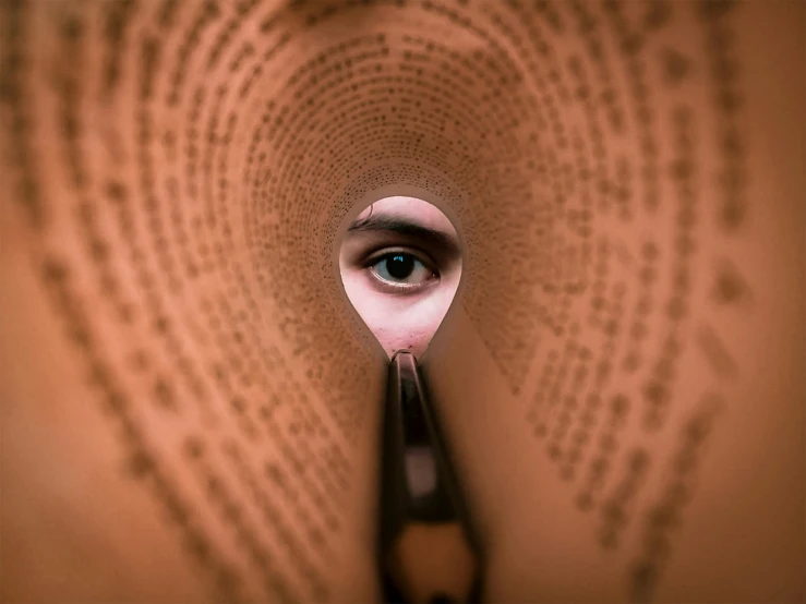 a spoon is sticking up from a picture of a man's eyes