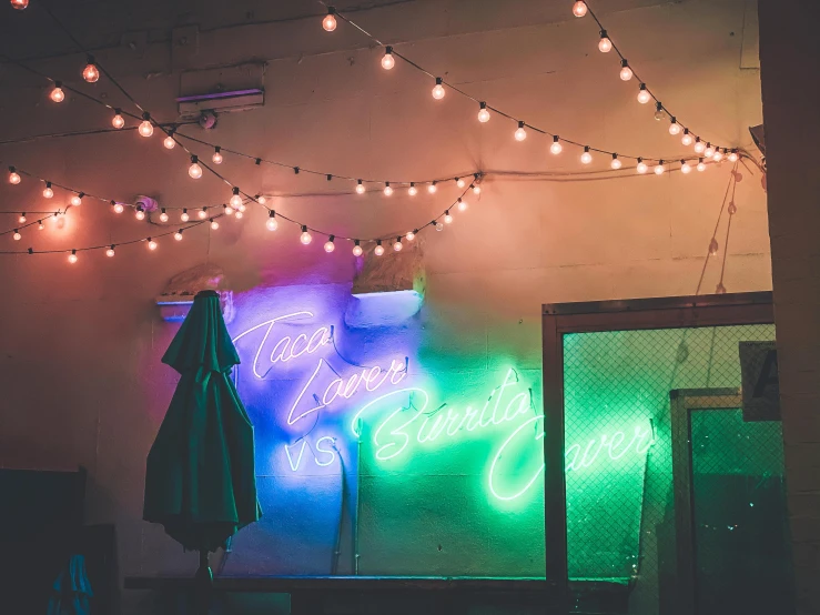 colorful lit up neon signs in a building