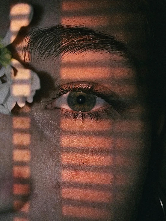 a po of a person and flower on their face
