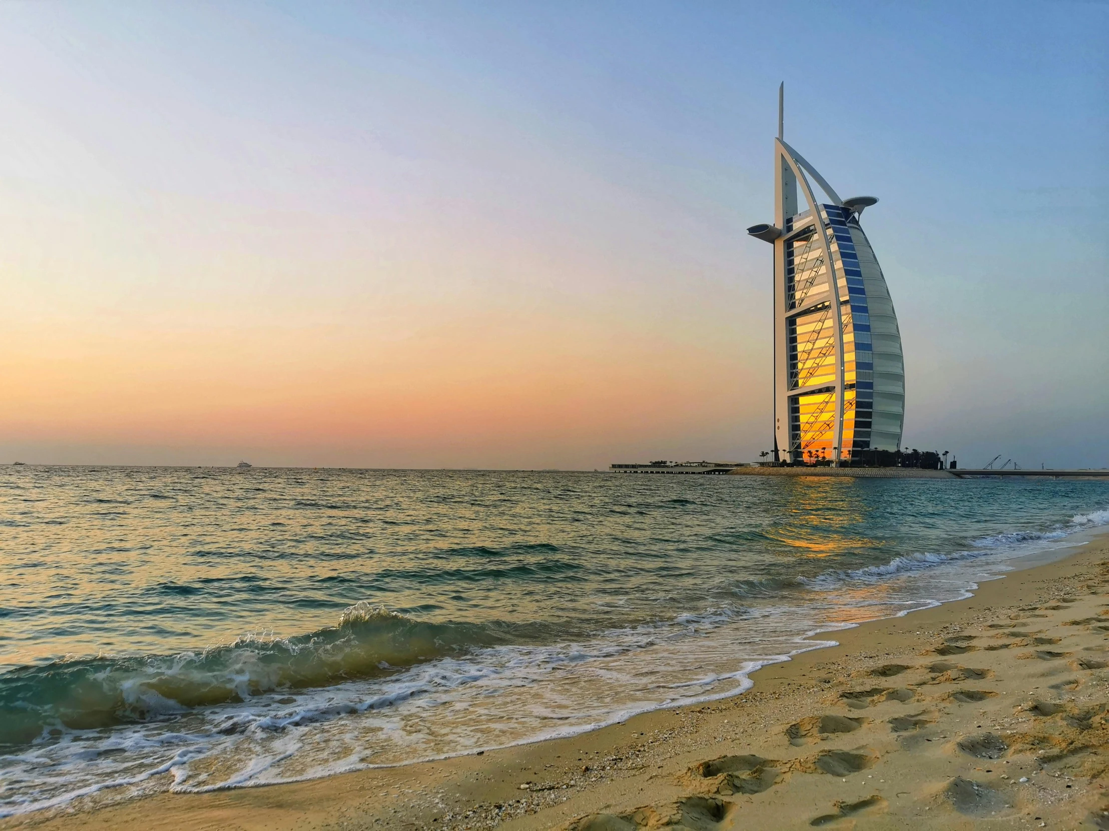 a beach with a tall building on top