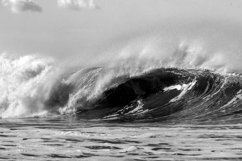 a large wave in the middle of the ocean