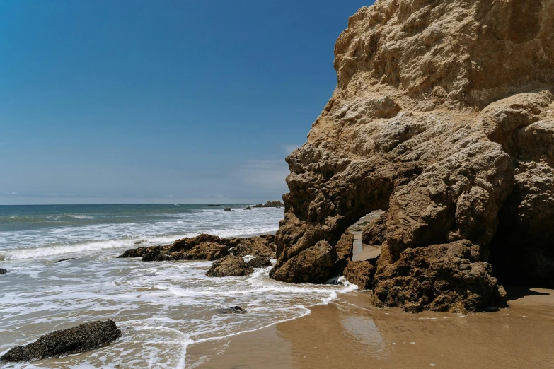 an ocean is lined with rocks and water