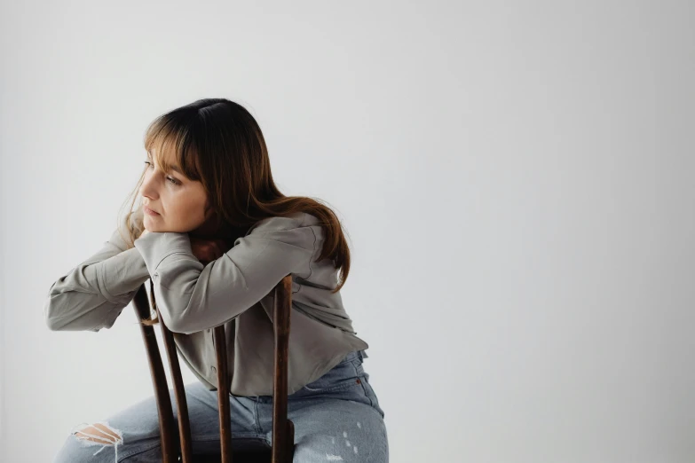 a woman sitting in a chair next to a door