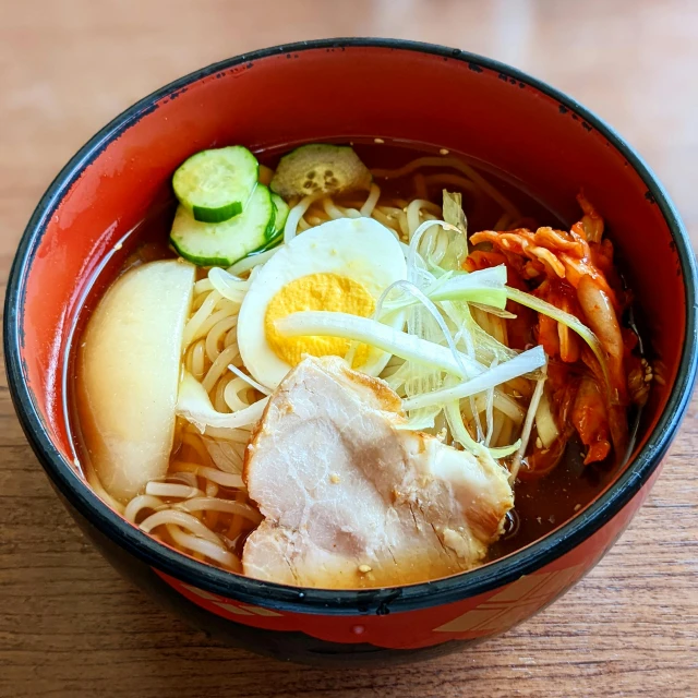 this is some sort of noodle soup with cucumbers