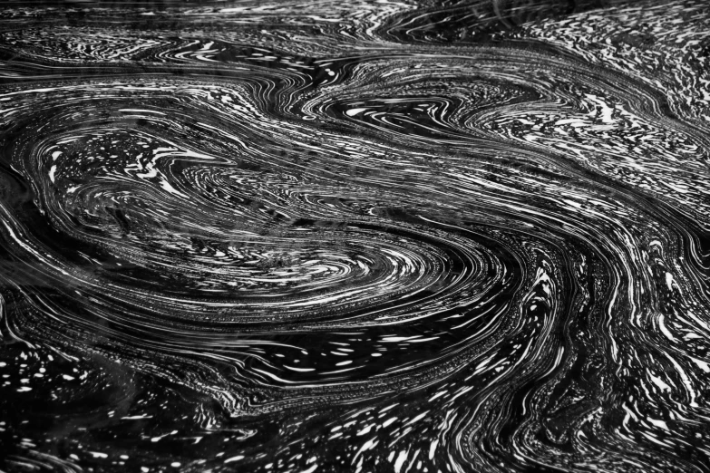 some water with a swirly black background