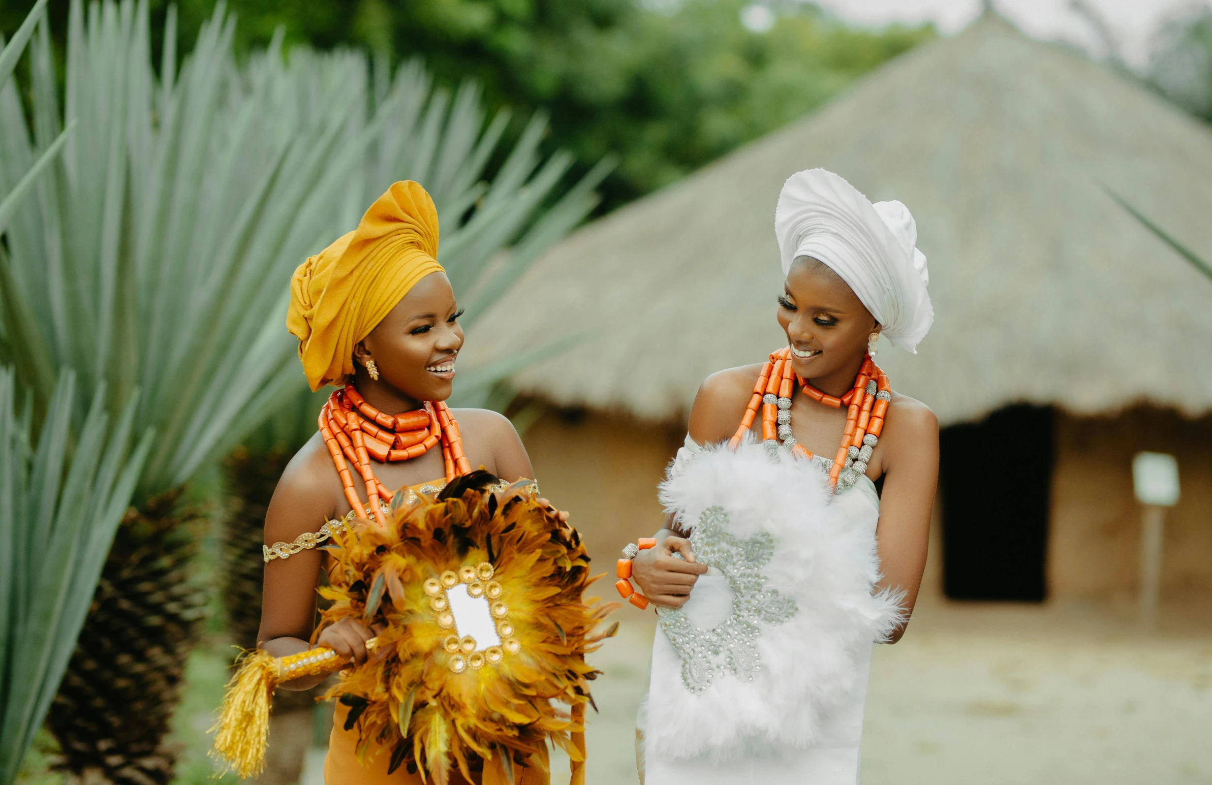 two women dressed in costume and holding soing