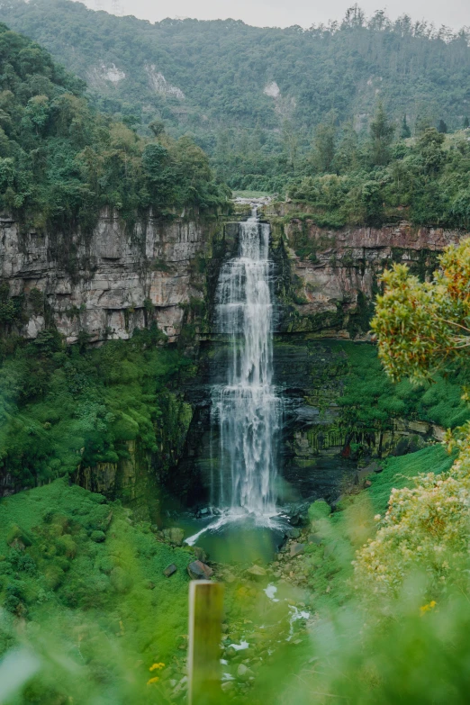 waterfall flowing into a deep, dark pool