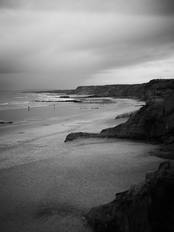 black and white pograph of beach and water