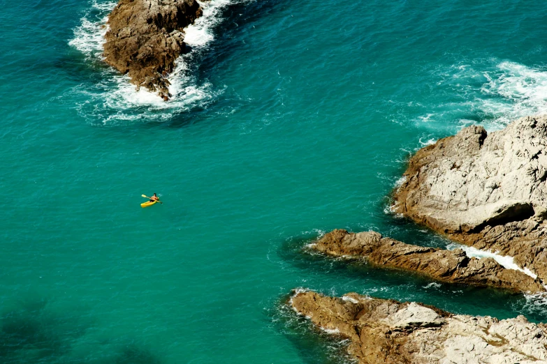 an overhead s of a body of water with waves