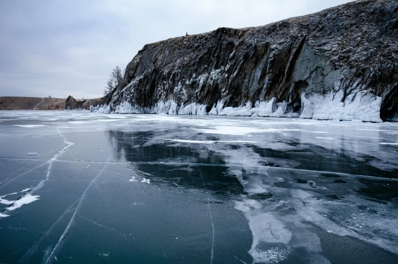 a hill with ice and water in the middle