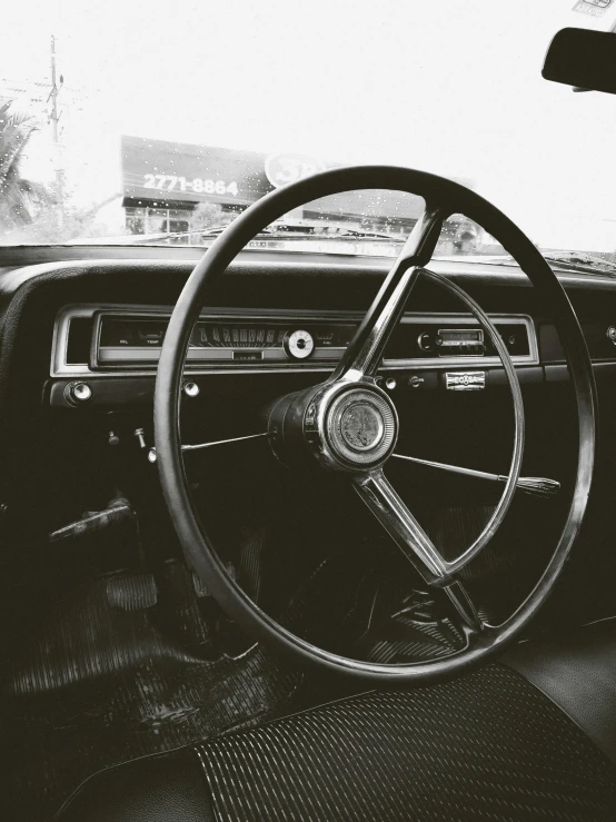 an old car with steering wheel and dashboard