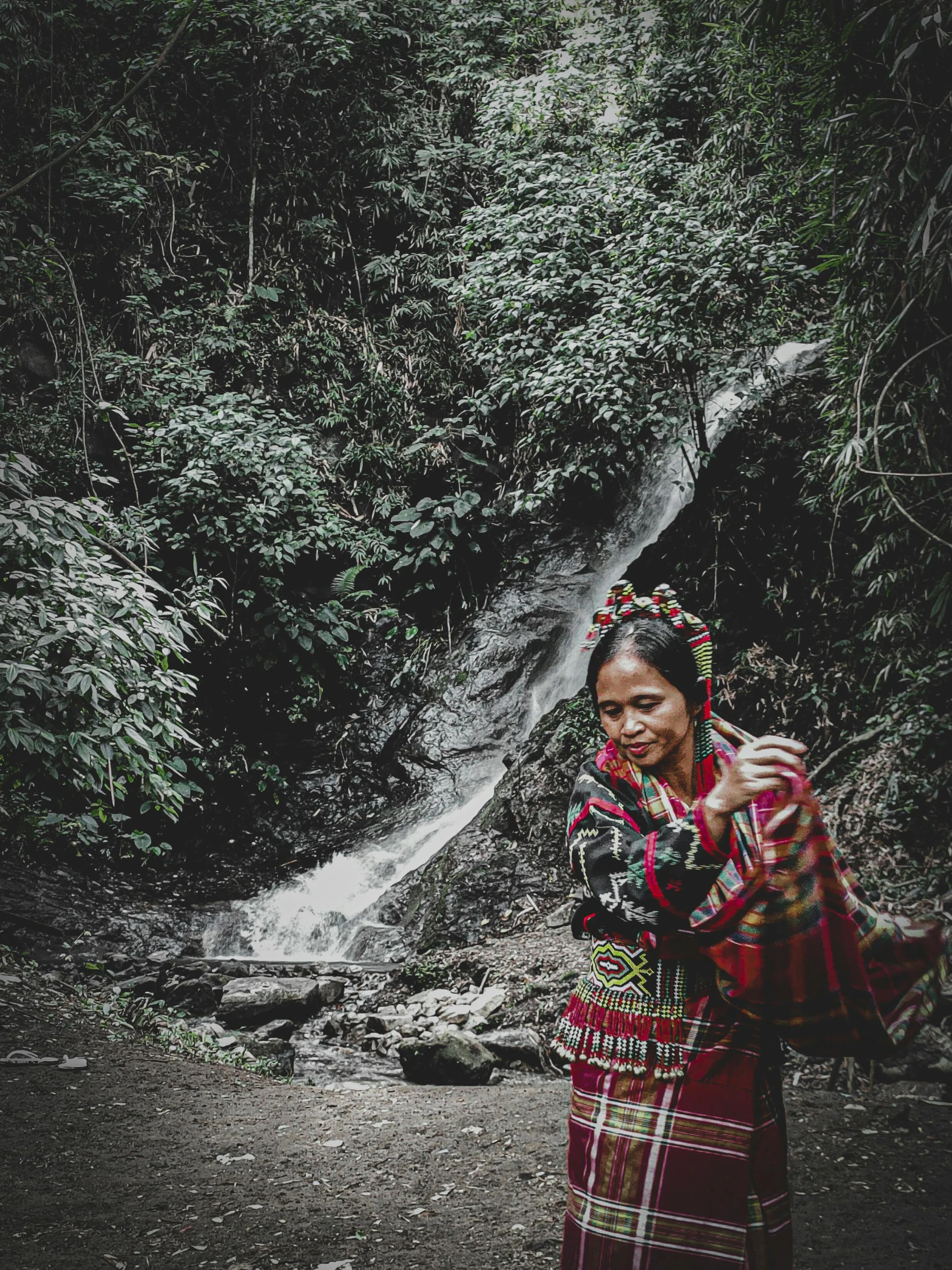 a woman in a red and green outfit