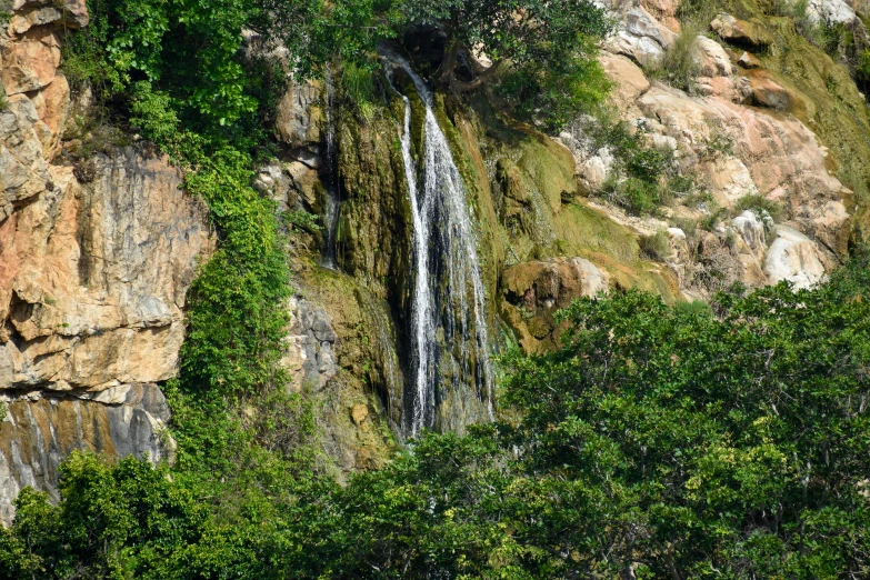 a waterfall cascading from the side of a cliff